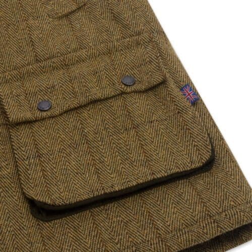 Detail van de zak van de tweed waistcoat voor heren