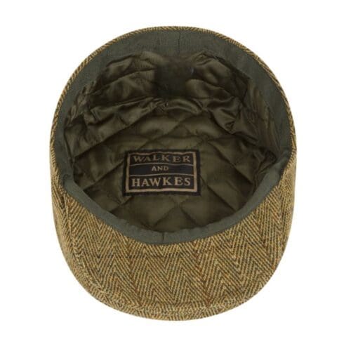 tweed flat cap in stro kleur van binnen getoond